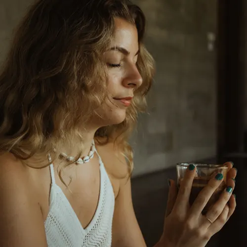 Student meditating with tea at Bali Yoga Teacher Training