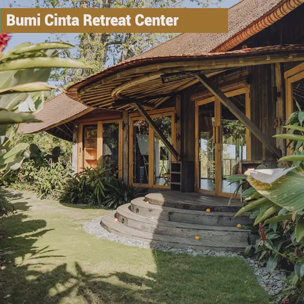 Bamboo entrance of Bumi Cinta retreat center surrounded by tropical gardens in Tejakula, Bali