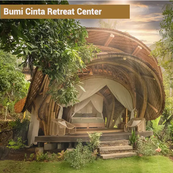 Open-air private bamboo bungalow with canopy bed at Bumi Cinta eco retreat center in Bali