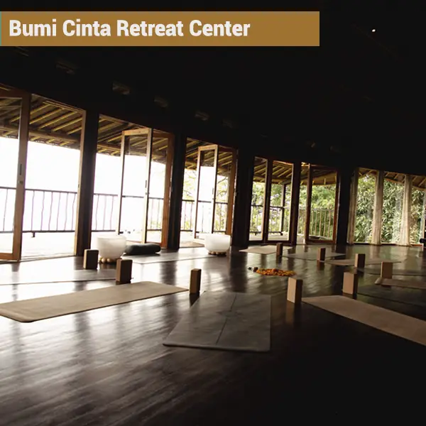 Open-air yoga shala at Bumi Cinta retreat center in Tejakula Bali with mats set up for a yoga teacher training class
