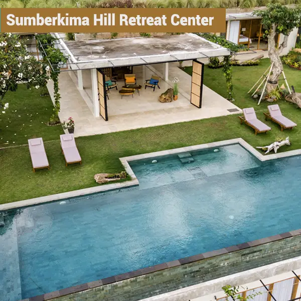 Aerial view of outdoor pool and tropical gardens at Sumberkima Hill retreat center in Northwest Bali